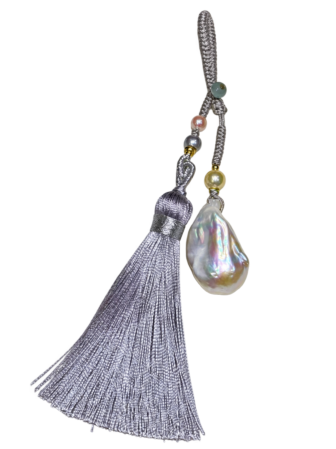 A baroque pearl charm with grey silk tassel and small accent beads