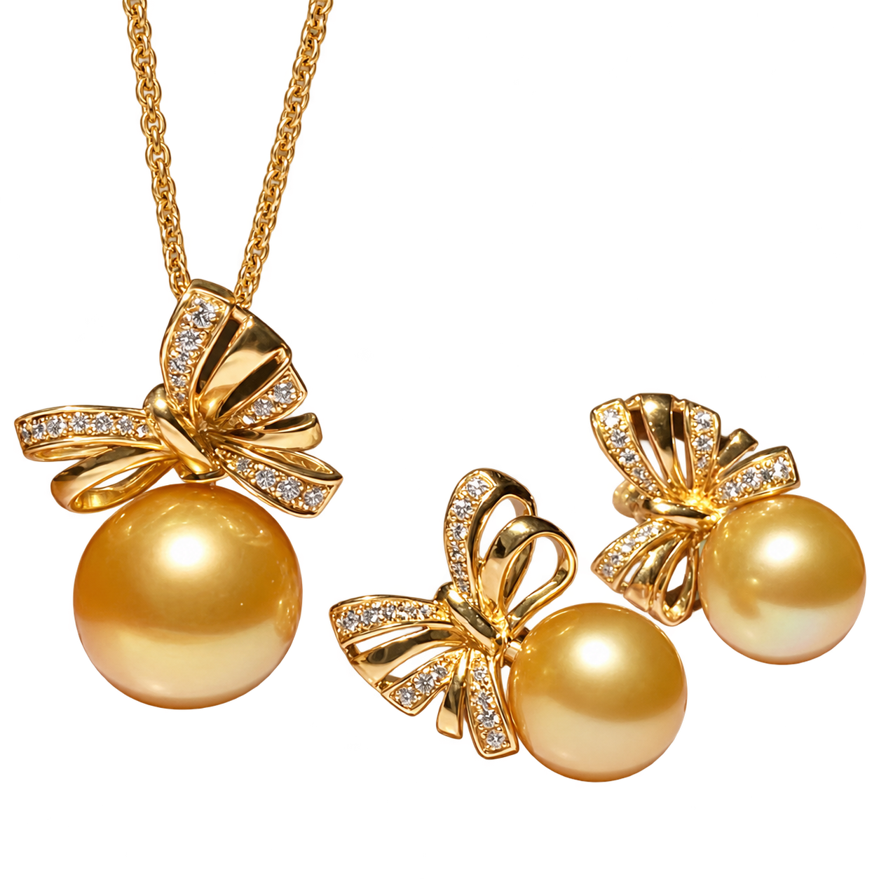 A golden pearl pendant and matching pair of earrings with open gold-coloured bows and small stones