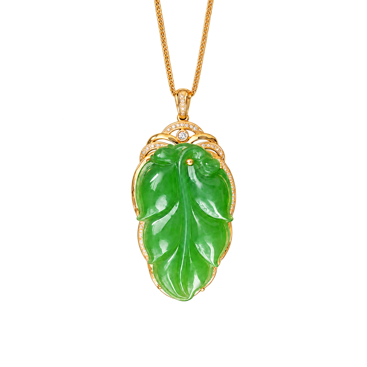 A green jade leaf pendant in a gold-coloured setting